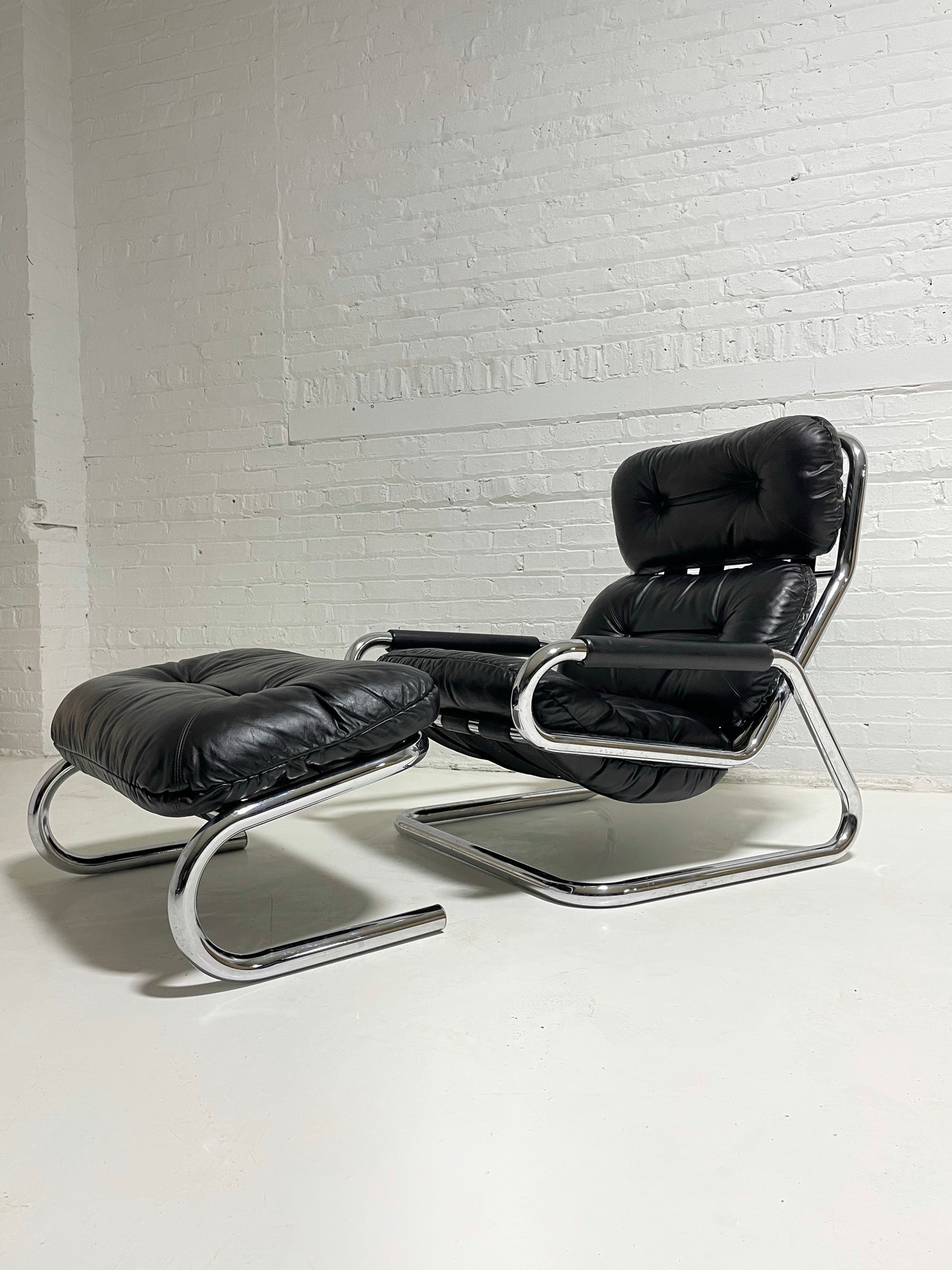 Pair of Black Leather and Chrome Lounge Chairs by Directional
