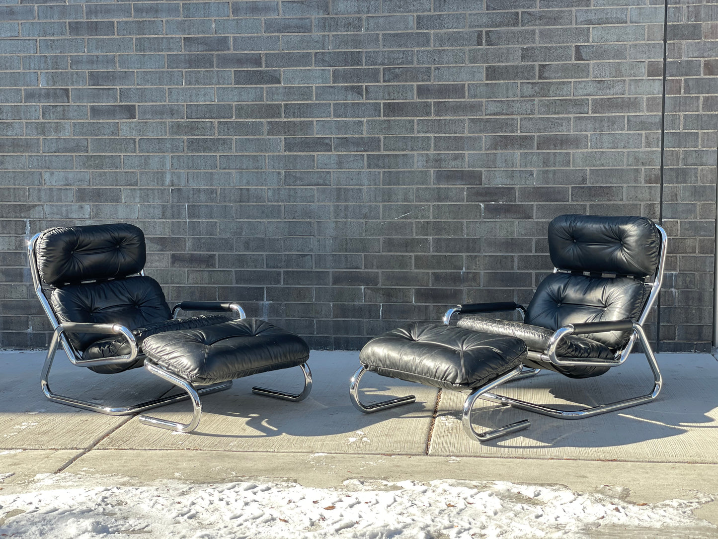 Pair of Black Leather and Chrome Lounge Chairs by Directional