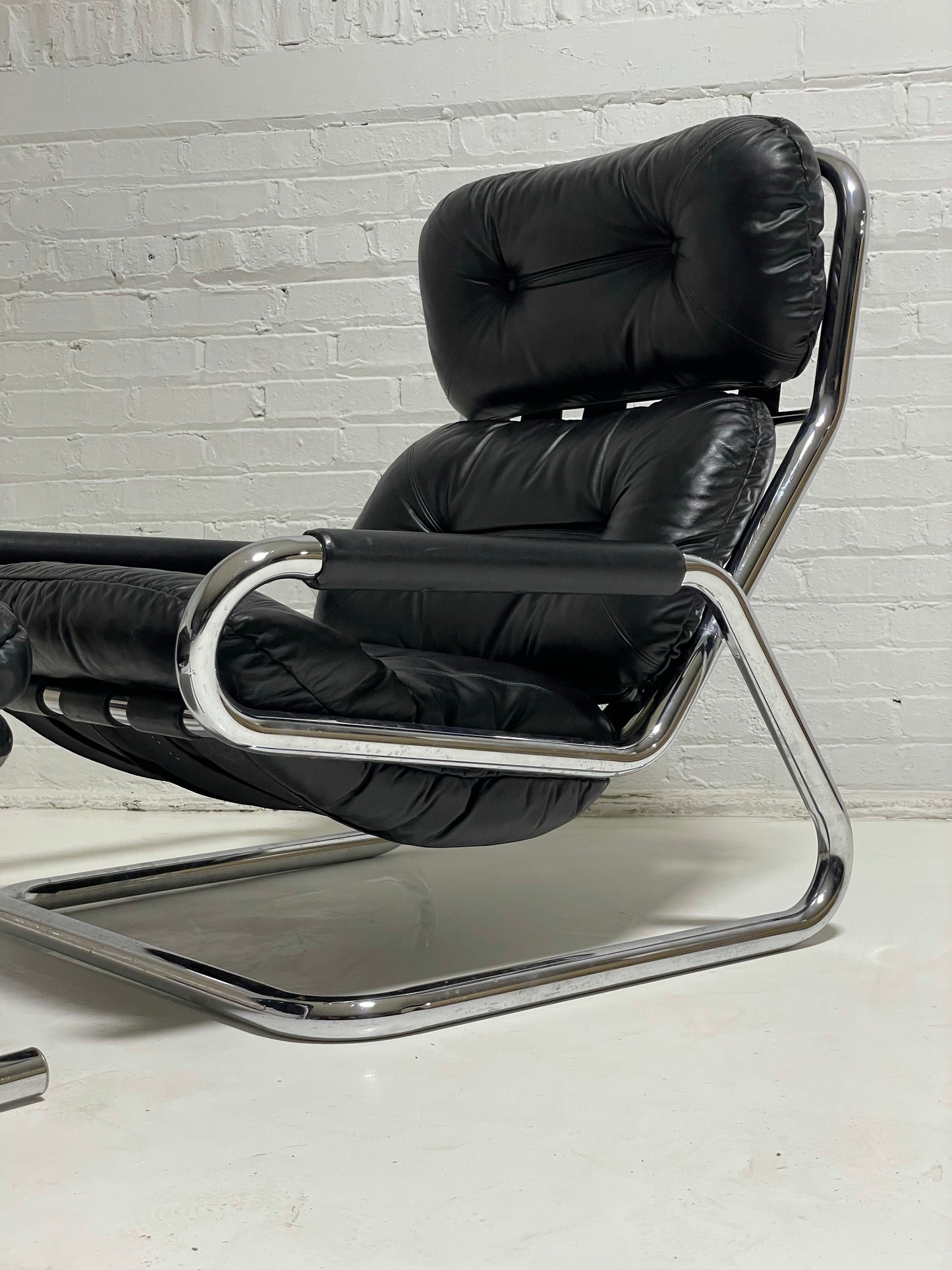 Pair of Black Leather and Chrome Lounge Chairs by Directional