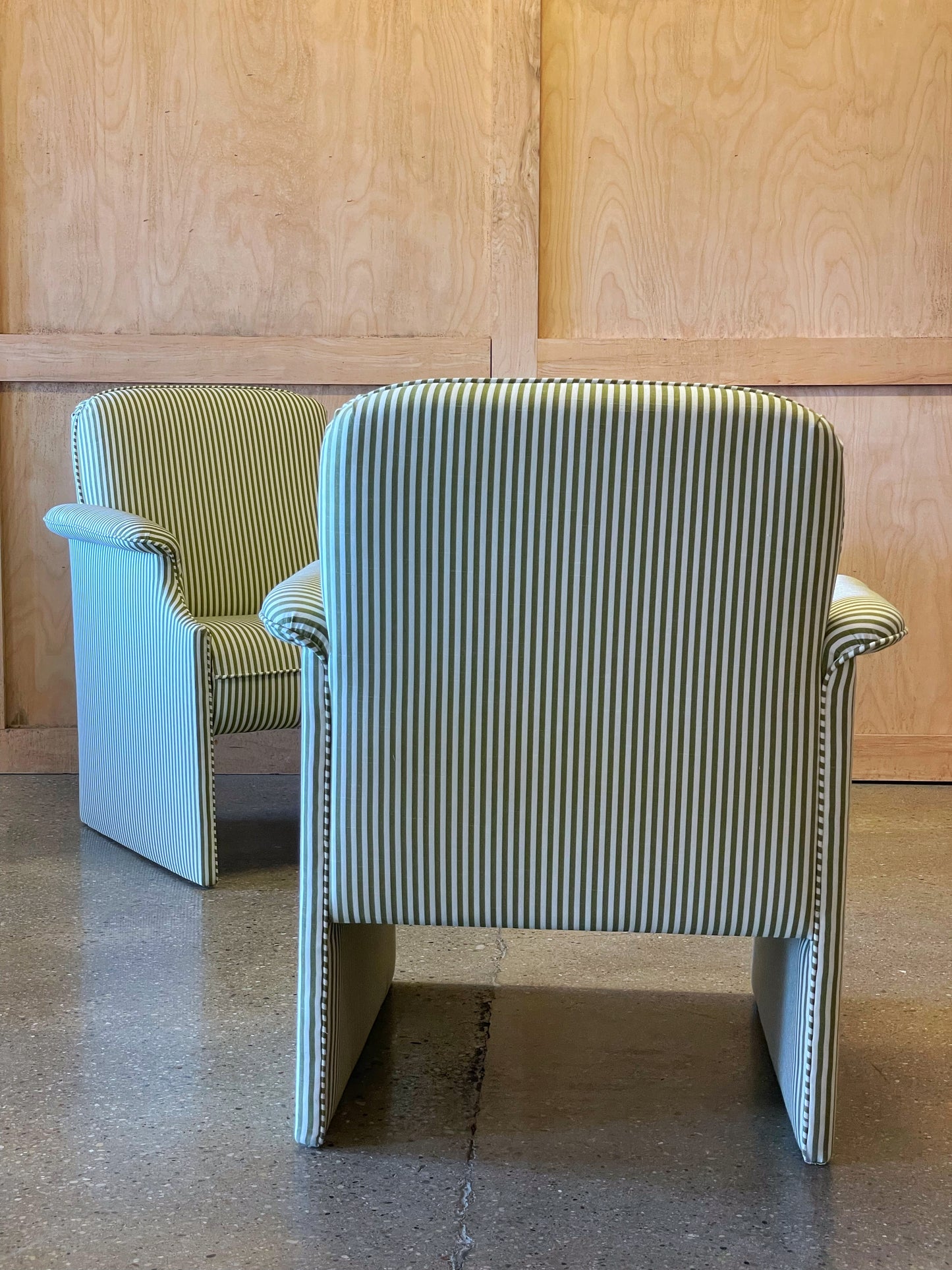 Pair of olive striped lounge chairs